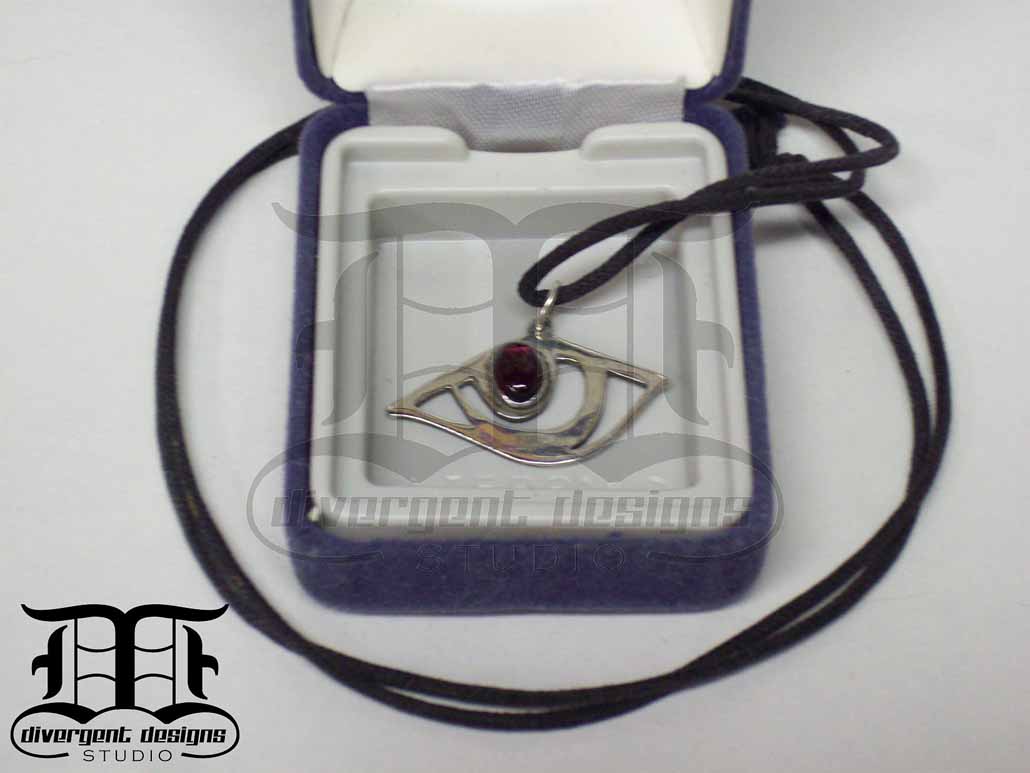 Dragon eye in silver & garnet